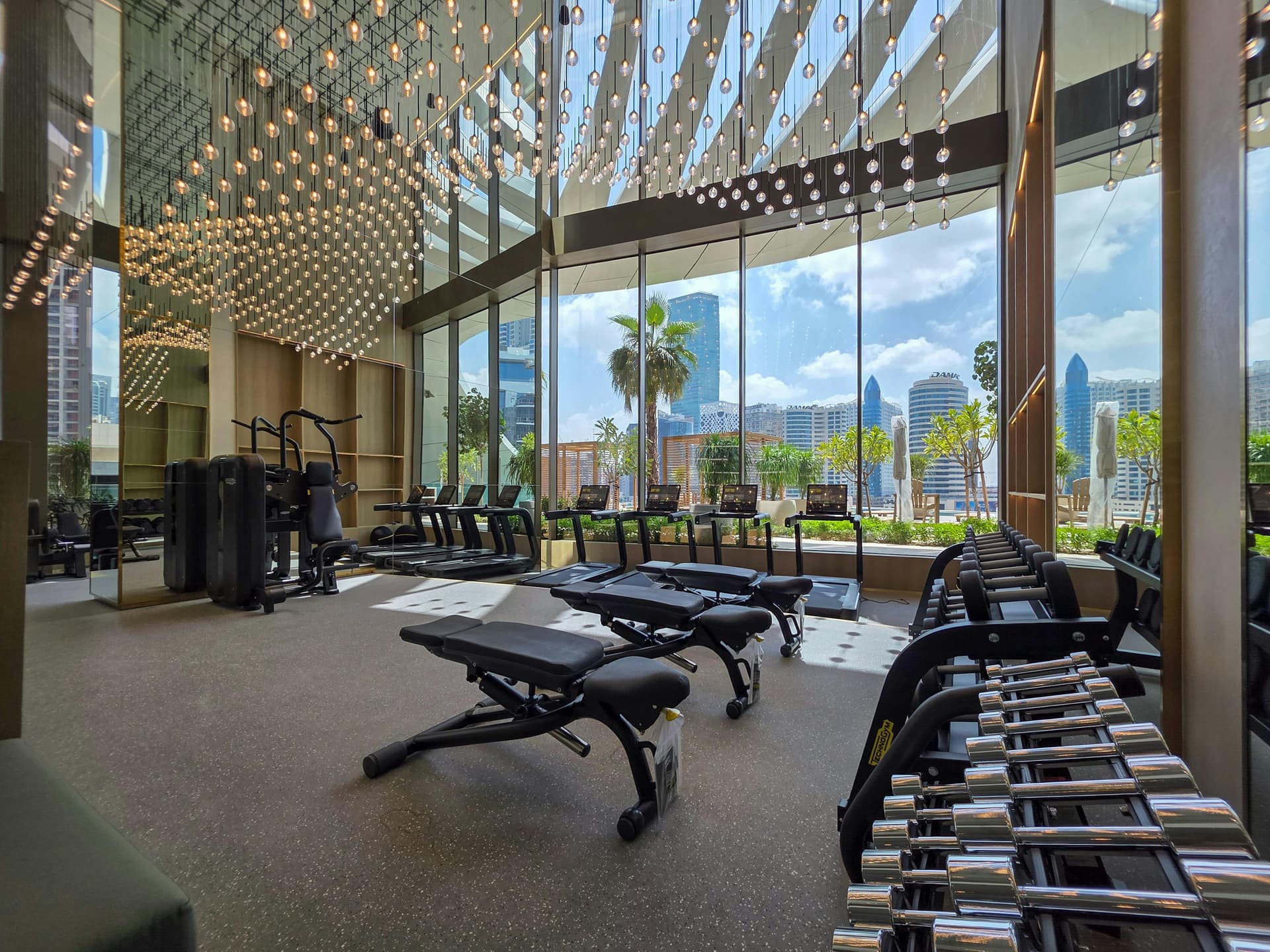 High-end minimalist gym interior with professional equipment and bright natural light